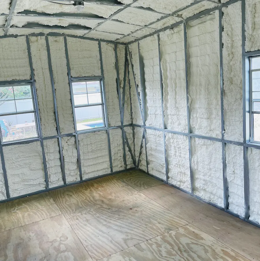Closed-cell spray foam insulation applied to wall cavities in a residential project in Keyes